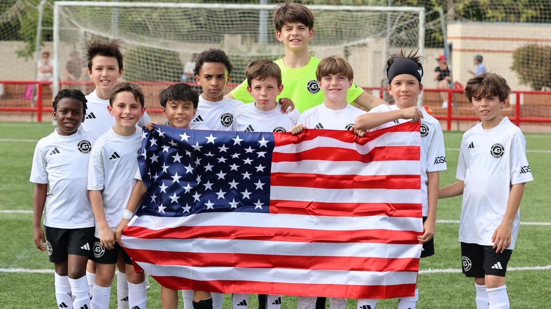 A group of AGSC players holding the U.S. flag at the 2025 International Showcase.