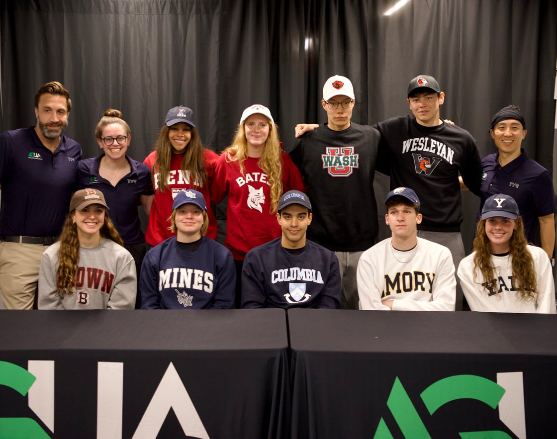 The AGUA 2026 graduating class and the AGUA coaches at the 2026 commitments celebration.