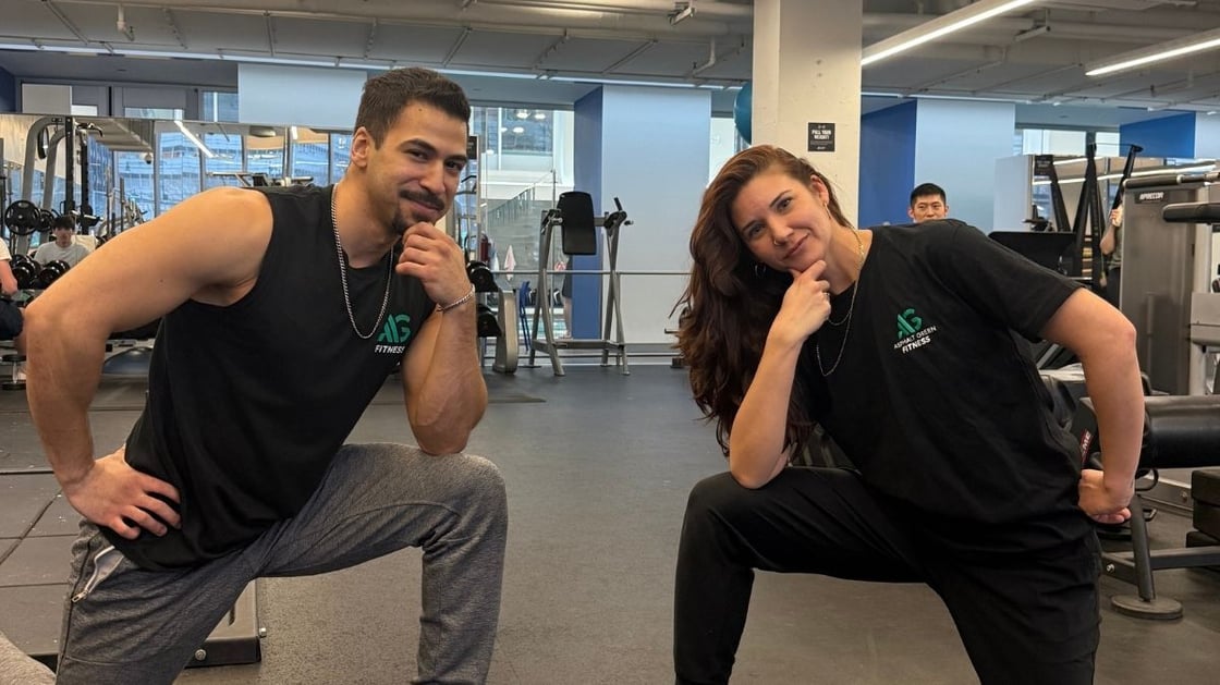 Two Asphalt Green personal trainers posing for the camera
