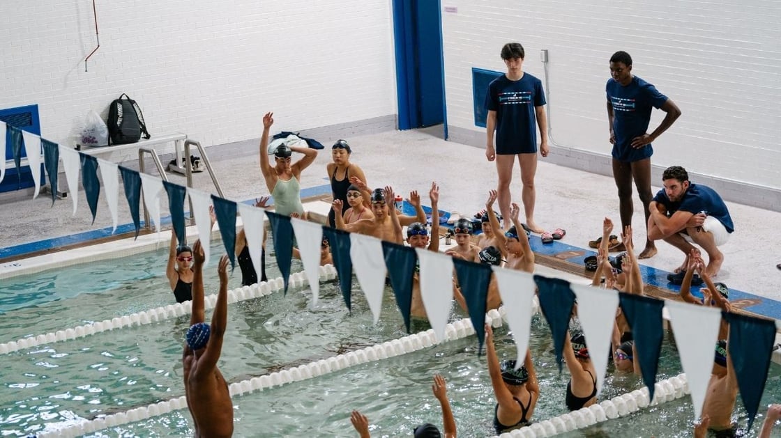 A group of students taking a swim class