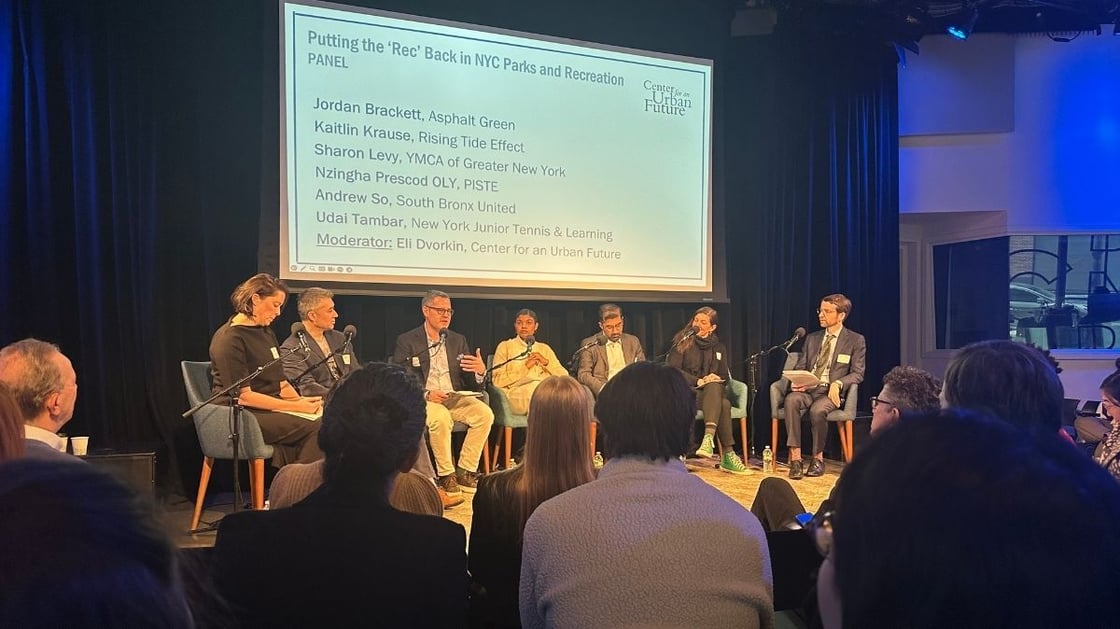 A group of people, including Asphalt Green's CEO Jordan Brackett, participating in a discussion at the Center for Urban Future’s recreation policy forum.