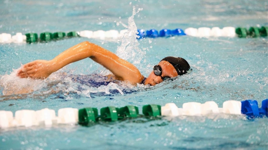 Child swimming laps in a pool